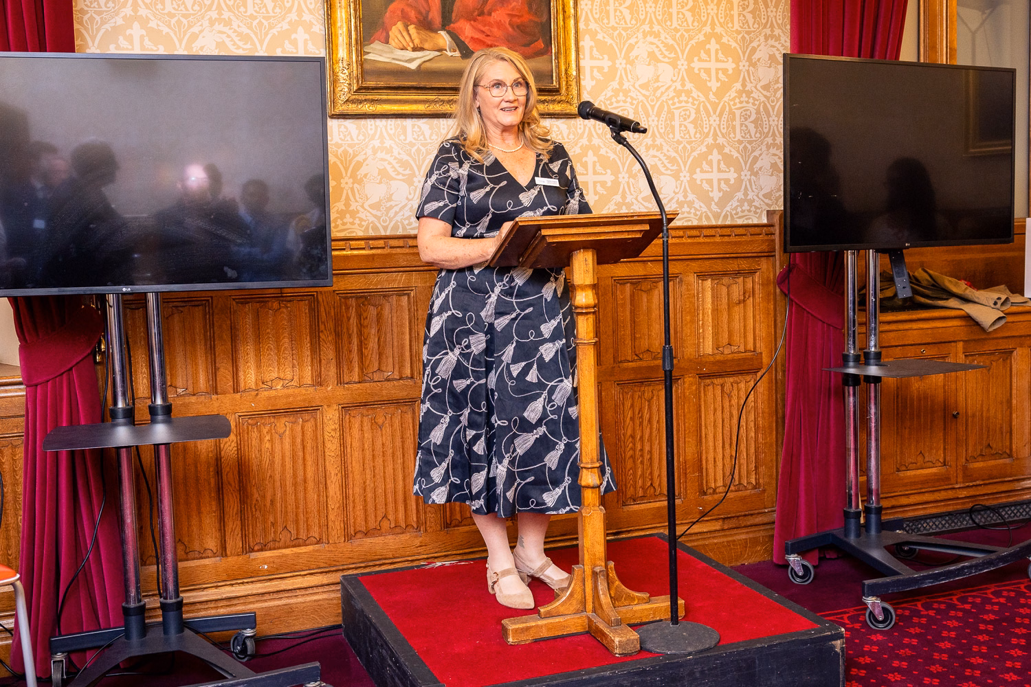 Karen Foard speaking at a lecturn