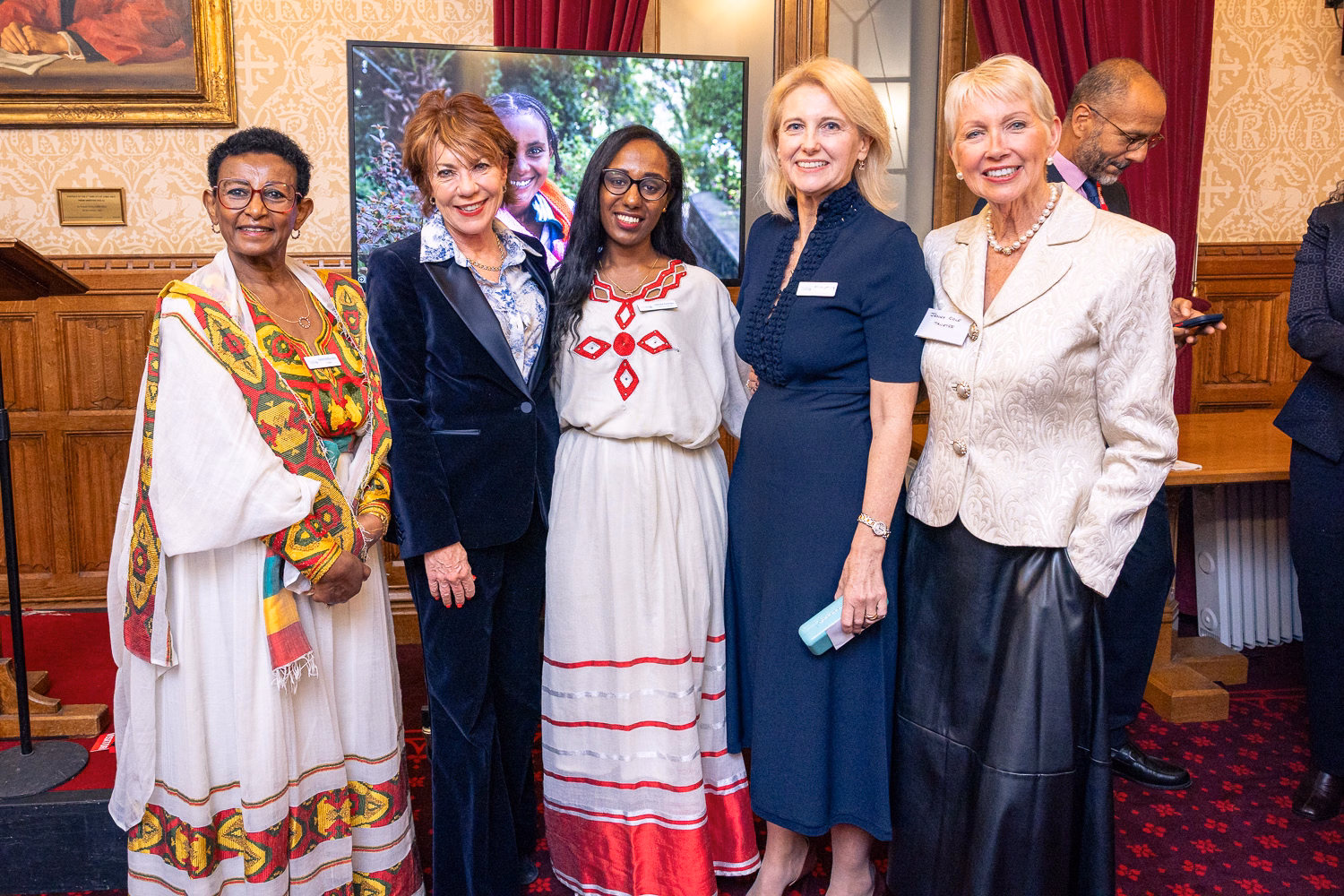 Kathy Lette with a group of women, including 2 in traditional Ethiopian dress